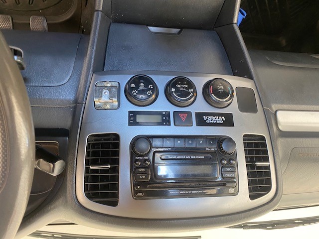 Suzuki Grand Vitara SUV 2004 used car part search Dash Trim (current one cracked), Climate control/fam/speed control Unit (unit fault), Antenna (broken), spare wheel cover. fi