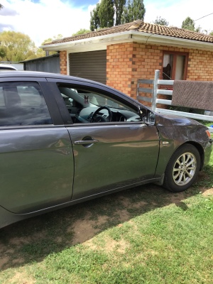 Mitsubishi Lancer Sedan 2010 used car part search Drivers door, glass and mirror, right hand front panel.  Urgent at least the glass.